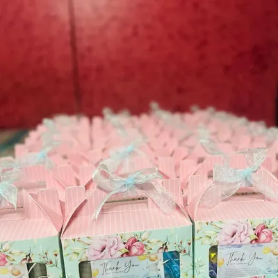 Here is a large order of baby shower return favors I prepared. Each box features a lovely floral and pastel design and is tied with a delicate ribbon, ready to thank the guests.
