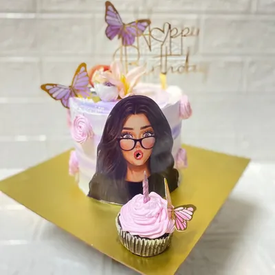 We can create a full dessert spread for your theme. Here, a custom cake with a printed character illustration is paired with a matching pink-frosted cupcake for the birthday girl.