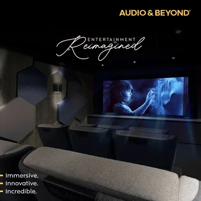 Entertainment, reimagined. This is our vision for an immersive, innovative, and incredible home cinema, featuring acoustically treated walls with hexagonal panels, comfortable tiered seating, and a perfectly calibrated screen for a truly cinematic feel.