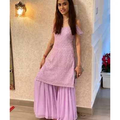 Lilac has my heart. My client Poovi looks lovely in this custom lilac sharara set with delicate embroidery and cold-shoulder sleeves, which she wore for her housewarming party.