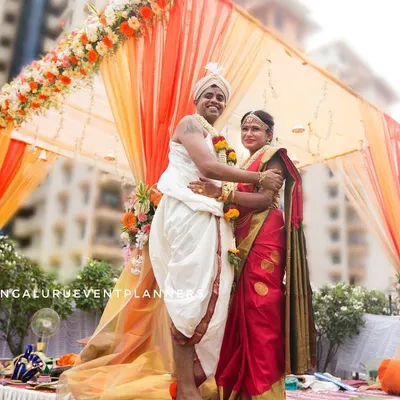 The wedding ceremony is the heart of the celebration, and we capture it with the respect and attention it deserves. Here, the couple shares a moment of connection under a beautifully decorated mandap, a key memory from their traditional South Indian wedding.