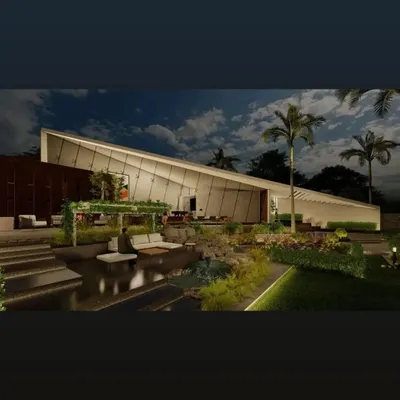 A stunning farmhouse design where the architecture follows the function. The dramatic sloped roofline and extensive use of glass create a modern silhouette against the night sky, overlooking a tranquil, beautifully lit landscape.