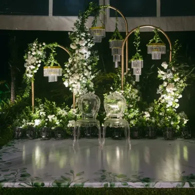 Sometimes, less is more. For this reception, we created a magical moonlight theme with minimalist decor, using elegant white florals, crystal chandeliers, and clean lines to craft a look that was simple yet stunning.