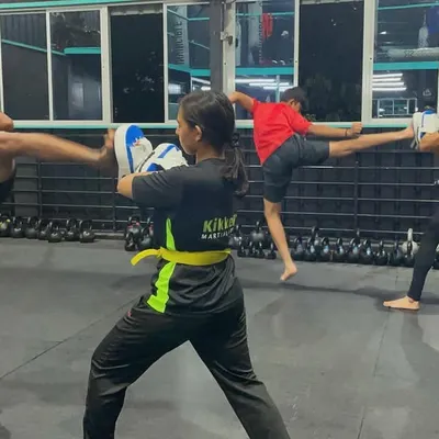 Double trouble. Two of our students perfectly synchronized during a kicking drill. It's moments like these that show how connected our group is.