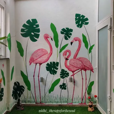 The completed flamingo mural brings a splash of color and tropical fun to this balcony, creating a perfect backdrop for relaxing or entertaining.