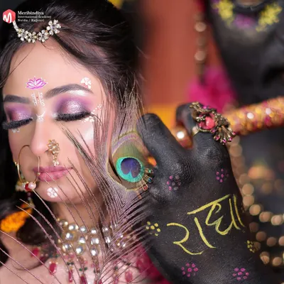 A truly artistic creation where makeup tells a divine story. This look involves intricate details, body painting, and thematic styling to represent Radha and Krishna.