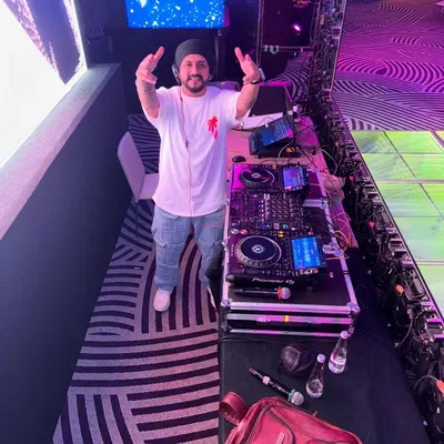 All set for a Friday night corporate gig. From my high-end Pioneer DJ setup to the massive LED screen in the background, every element is in place for a memorable event.