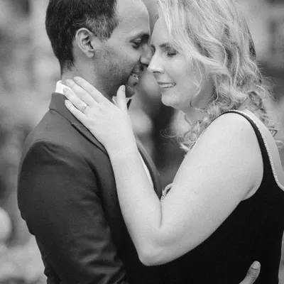 A classic, romantic black and white portrait. This intimate pre-wedding photo focuses on the close connection and quiet affection between the couple, creating a timeless and heartfelt image.