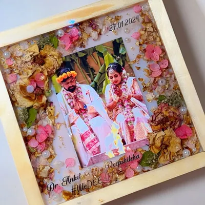 This is one of my favorite ways to preserve wedding memories. I take your beautiful varmala and a special photo, and seal them forever in this classic pine wood frame, creating a piece of art you can cherish daily.