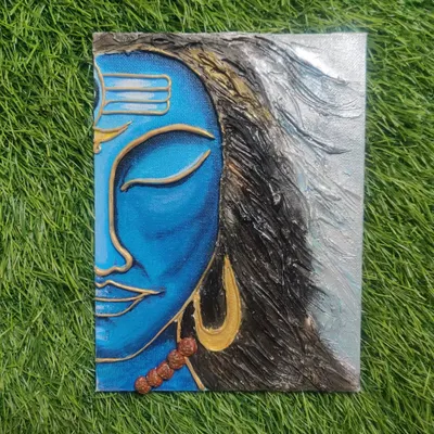 This textured canvas painting captures the tranquil face of Lord Shiva. I used clay and acrylics to create a 3D effect on his hair and features, making it a powerful piece for meditation.