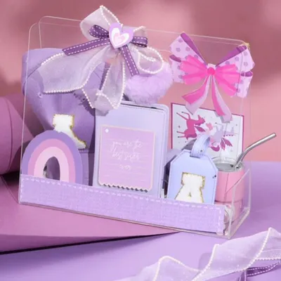 Our 'Princess Treatment' hamper in a lovely shade of purple. This box is filled with personalized items like a cap, a luggage tag, and other cute accessories for a little sister.
