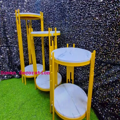 A set of modern, gold-framed plinths with faux marble tops. These are perfect for displaying cakes, desserts, or decorative props at any event.