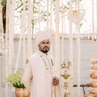 A stylish portrait of the groom, looking sharp and ready for the main event. I focus on capturing a sense of confidence and anticipation.