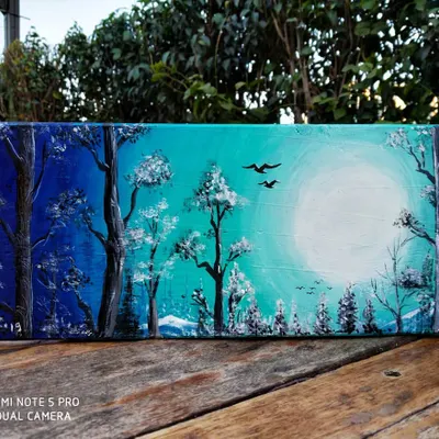 This landscape on a wooden sheet shows a serene forest illuminated by a bright moon. Using a wooden base instead of canvas gives the painting a unique, rustic quality that I really like for nature scenes.