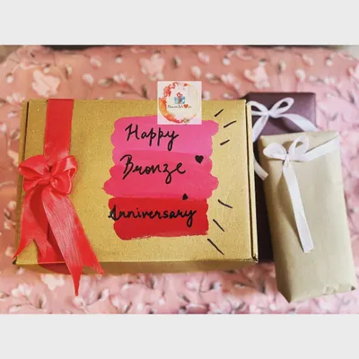 The beautifully hand-painted exterior of our "8 gifts for 8th anniversary" box. We call this the Bronze Anniversary, and the individually wrapped gifts are waiting inside.