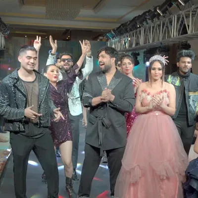 The final walk is always a celebration. Here I am on the ramp with my showstoppers and models after a successful show, soaking in the amazing energy from the audience.