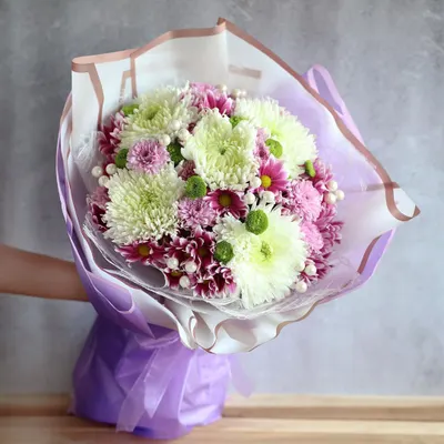 As delicate as a petal and as strong as the fragrance. This beautiful hand-tied bouquet of chrysanthemums is a perfect gift for the strong women in your life.