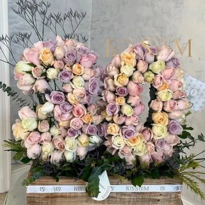 I call this "Dreamland." For an 80th birthday, I created these floral numbers using a glorious mix of lavender, baby pink, peach, and white roses, all composed in one of my signature rustic wooden boxes.