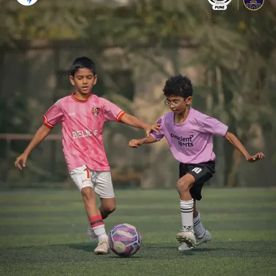Game faces on, energy high. A player dribbles with determination during a Week 6 match in the SFL Pune league.