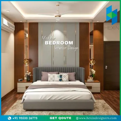 This master bedroom combines luxury and comfort with a floor-to-ceiling headboard featuring wood fluting and mirror panels. The false ceiling with cove lighting adds a soft glow, creating a perfect ambiance for relaxation.