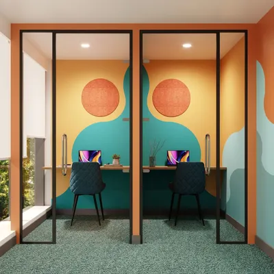 We create solutions for both group work and individual focus. These colorful, art-inspired acoustic pods offer a quiet, private space for concentration or one-on-one calls, blending seamlessly into the office aesthetic while providing essential functionality.