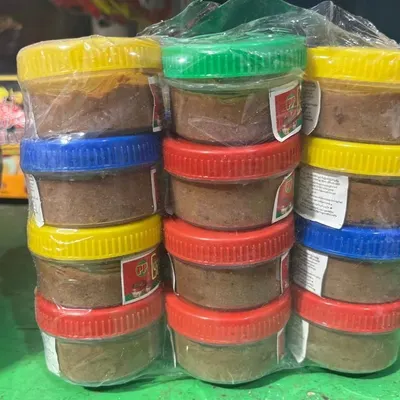 These are jars of my authentic Manipuri fermented fish paste (ngari), ready for sale. I ensure it's the real, potent version used in traditional home cooking.