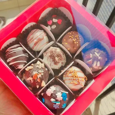 A box of nine of my assorted handmade chocolate truffles. This is a perfect budget-friendly yet delicious gift for any chocolate lover.