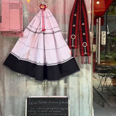Our decorations for the Tuluni festival, a celebration of harvest and kinship for the Sumi Naga tribe. We displayed traditional garments and a small board explaining the festival's meaning.