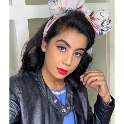 I love recreating iconic eras. This 90s inspired look features a classic sharp winged eyeliner and a bold red lip, perfect for a retro-themed photoshoot or anyone wanting a vintage vibe.