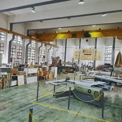 A wide view of our expansive workshop, showing the various workstations, machinery, and ongoing student projects. The facility is designed to support a full class of students working simultaneously.
