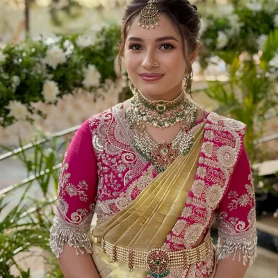 A timeless Muhurtham look for the sister of the bride. The makeup is elegant and traditional, designed to complement the bride's look while allowing her own beauty to shine.