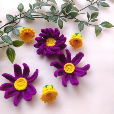 A new project is in progress. I am working on some new flower designs in purple and yellow. I am excited to see how these will turn out.