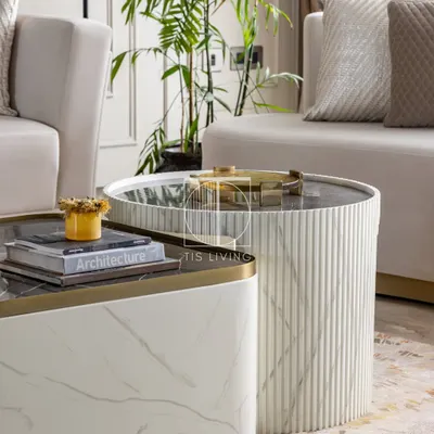 This fluted coffee table is a quiet showstopper. The hand-painted marble texture, soft curves, and golden accents create a piece where craftsmanship meets calm.