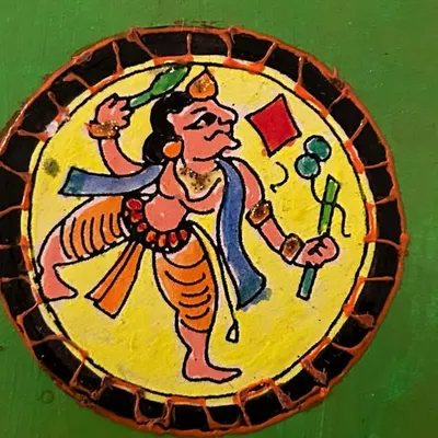 This is a hand-painted coaster featuring Ganjifa art, a traditional Persian and Indian card game art form. I love exploring and recreating these unique folk art styles in my work.