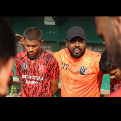 A quiet moment of focus and instruction from our coach during the Republic Cup finals. Guidance and mentorship are key to our approach.
