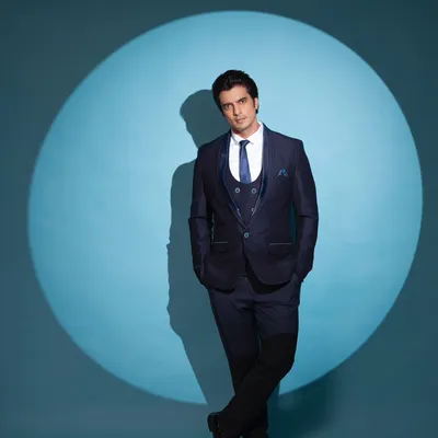 Styling actor Gashmeer Mahajani in a sharp, three-piece navy blue suit. This look is perfect for a formal reception or cocktail event, exuding confidence and modern sophistication.