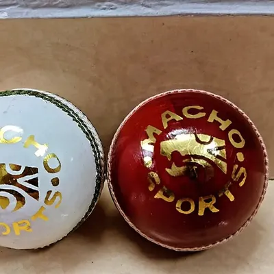 The tools of our trade. We use high-quality Macho's Sport red and white leather balls in our training sessions to simulate real match conditions.