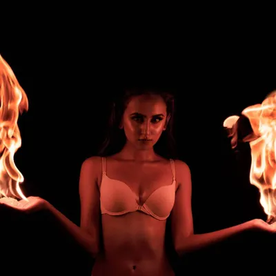 The 'Benki' fire shoot. This image is all about control and power, balancing the raw element of fire with the model's calm intensity. It’s a technically challenging but incredibly rewarding style of photography.