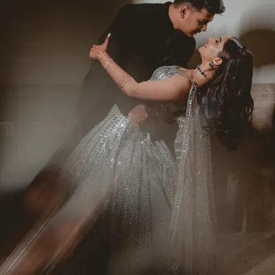 A dramatic dip on the dance floor, using motion blur to capture the energy and romance of this Sangeet performance.