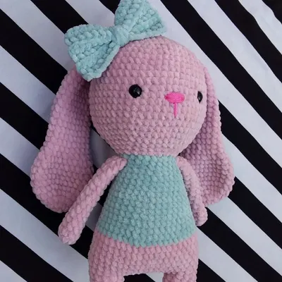 This super soft bunny was a custom order, made with plush pink and mint green yarn. The big bow on her head adds an extra touch of cuteness.