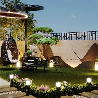 We transformed this backyard into a stunning oasis. The design features a comfortable seating area under a modern light fixture, unique marble-clad planters, and beautiful landscaping for a perfect blend of luxury and comfort.
