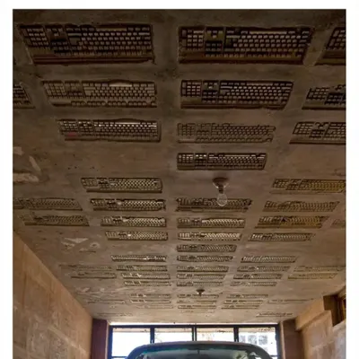 The ceiling of the car park at the Professor's Residence, made by embedding discarded computer keyboards into the concrete slab. This is one of our favorite examples of creative upcycling, turning e-waste into a unique textural element.