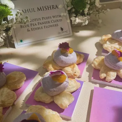 As delicate as couture embroidery. These mini lotus puffs with a bluepea paneer cloud and edible flowers were created for fashion designer Rahul Mishra's store launch. We love designing food that perfectly matches the theme and elegance of an event.