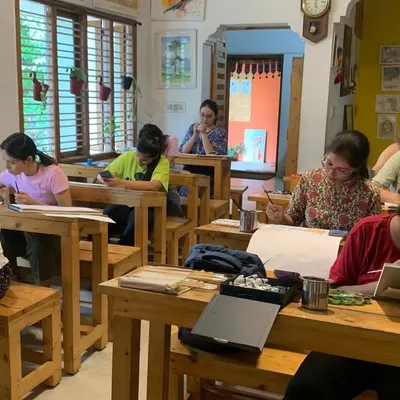 A wide view of our classroom shows the heart of our Gurukul. Here, students of all ages sit together, each on their own artistic path but united by a shared passion for learning and creating.
