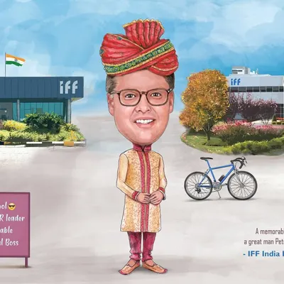 A wonderful farewell gift for a strategic HR leader at IFF, featuring his Indian and US offices, his love for cycling, and a traditional turban.