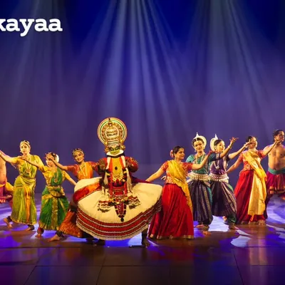 A full cast performance of 'Colours of India', featuring a central Kathakali dancer. This production is a vibrant tapestry of classical, folk, and martial dance forms from across the country.