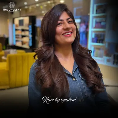 A beautiful example of a layered haircut combined with a rich, warm brown color. The final style has incredible volume and movement.