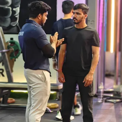 Communication is key. A coach takes the time to explain the mechanics of an exercise to a client, ensuring they understand the movement before they even lift.