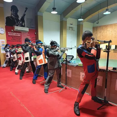 A line of my shooters in perfect formation, aiming down the range. This image captures the synergy and discipline that is a hallmark of our daily training sessions.