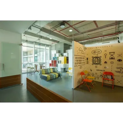 For the 8-Bit office, we created this fun breakout space. The doodle wall and colorful chairs provide a relaxed contrast to the main work areas, giving the team a place to unwind and chat.